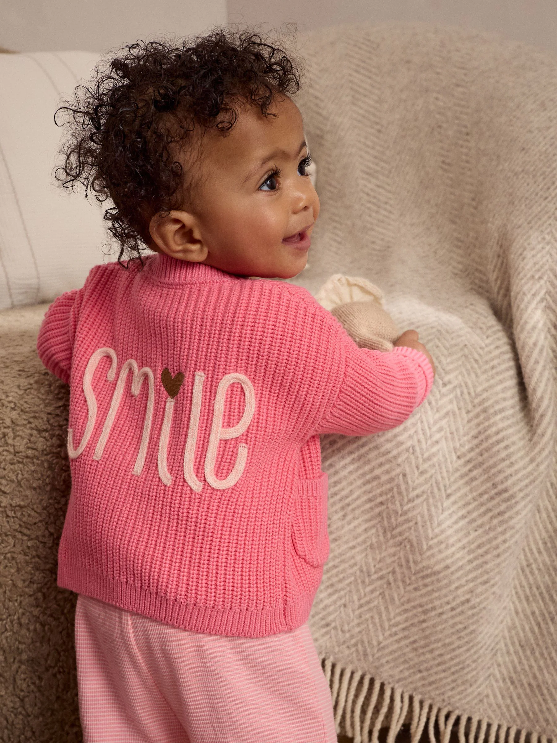 Roze met smiley - Geborduurd vest (0 mnd - 2 jr)