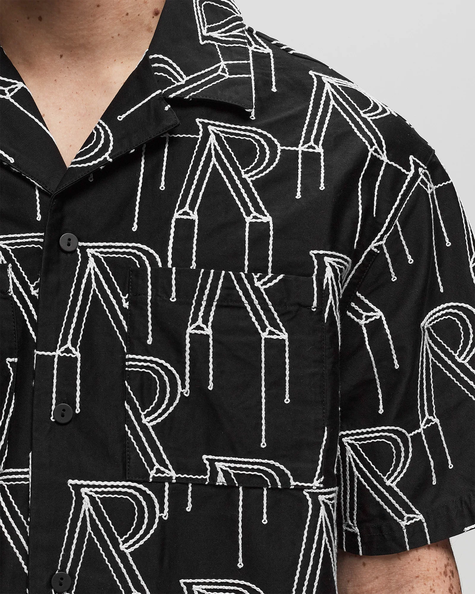 Represent EMBRODIERED INITIAL OVERSHIRT