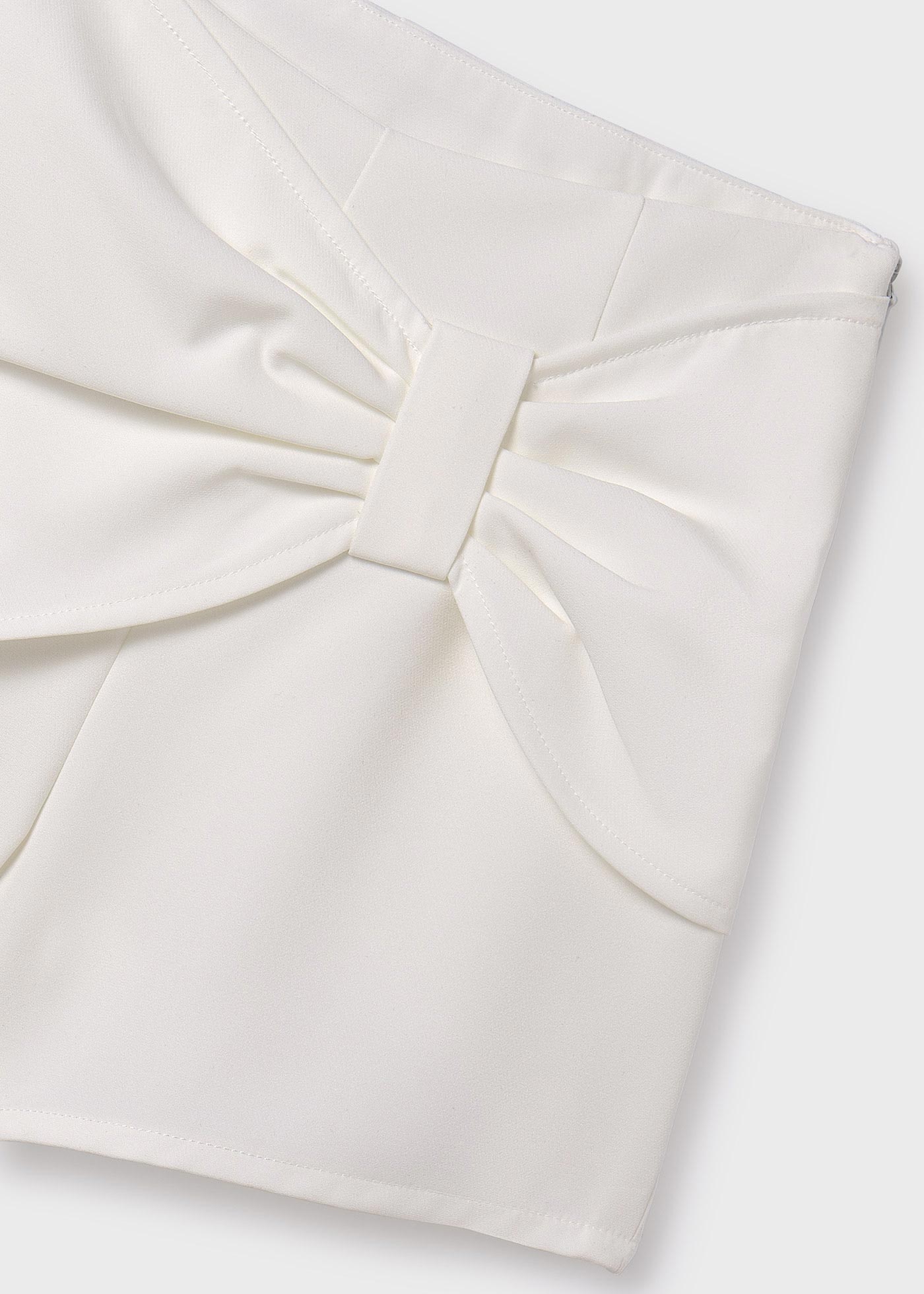 Saia-calça com laço, cor creme para menina