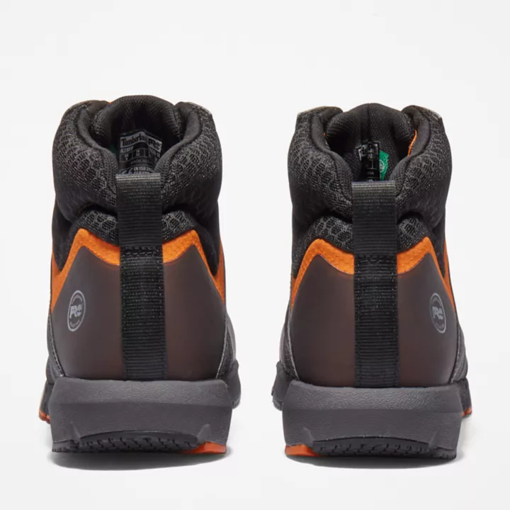 Bota de trabalho Radius com biqueira de liga leve para homem, nas cores preta e laranja.