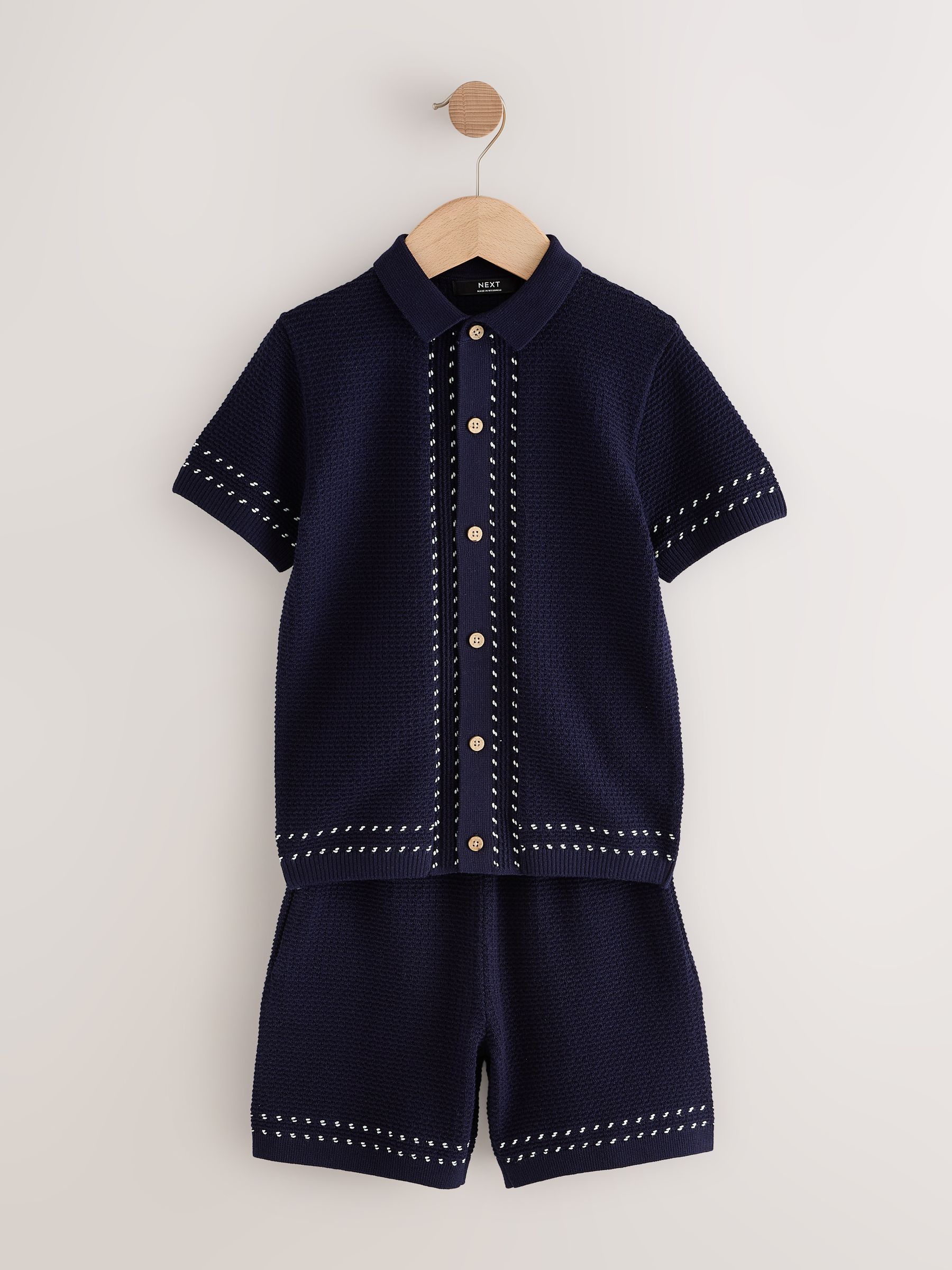 Donkerblauw - Set met getextureerd gebreid poloshirt met knoopsluiting en short (3-16jr)