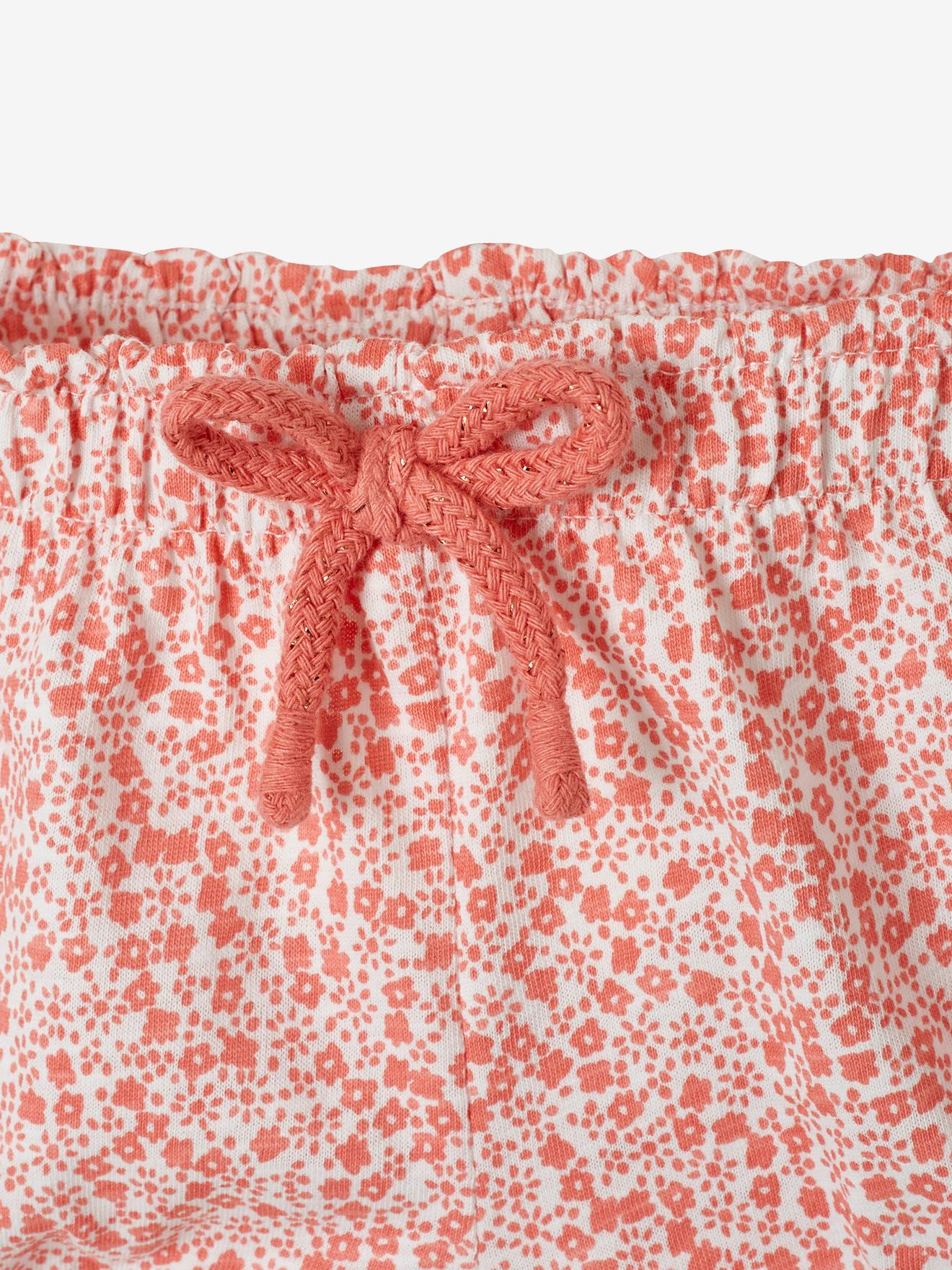Calção infantil para menina em malha branca clara com estampa.