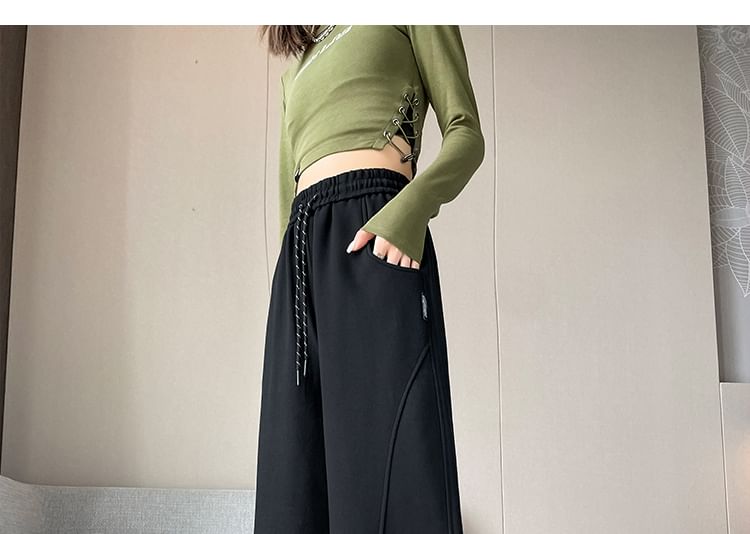 Isaaca - Effen joggingbroek met trekkoord en wijde pijpen