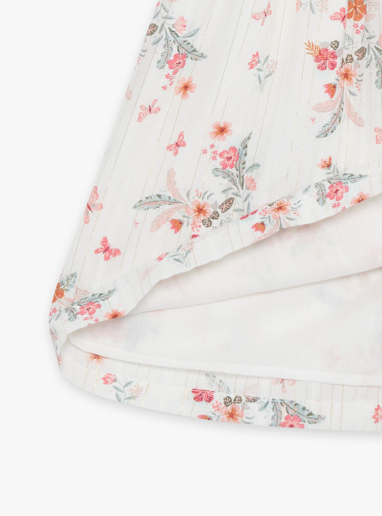 Robe écrue à volants et fleurs