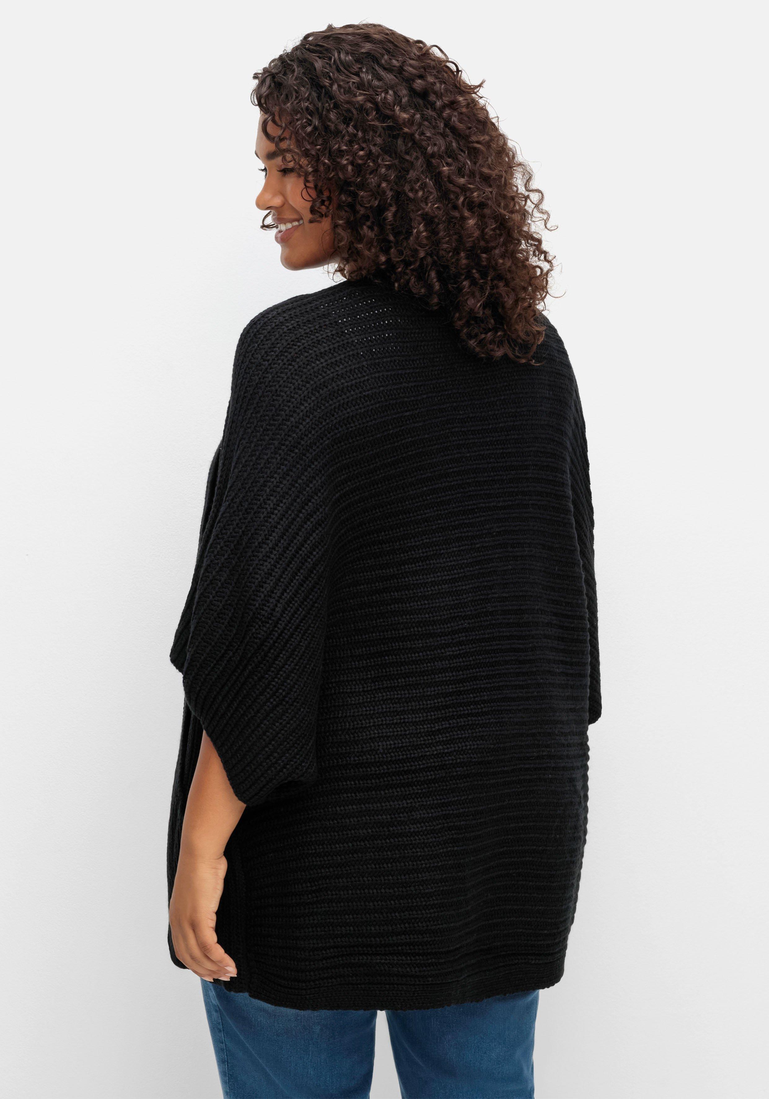 Strickjacke in offener Form, mit verkürztem Ärmel