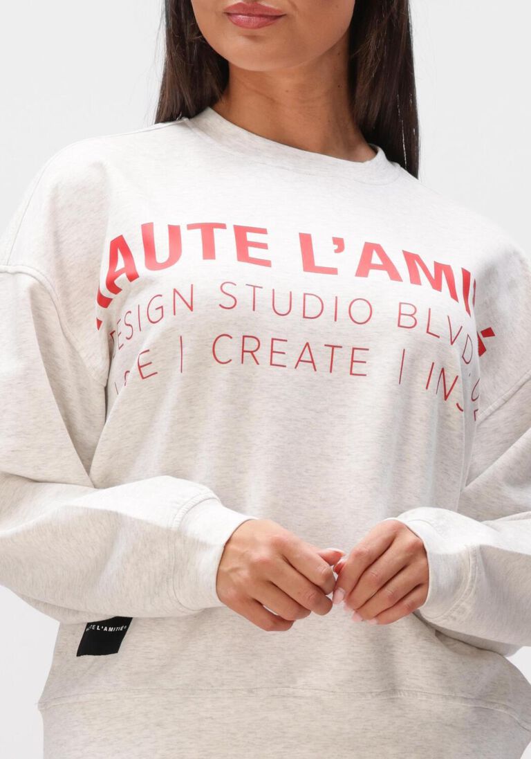 lichtgrijze haute l'amitié sweater studio logo sweat
