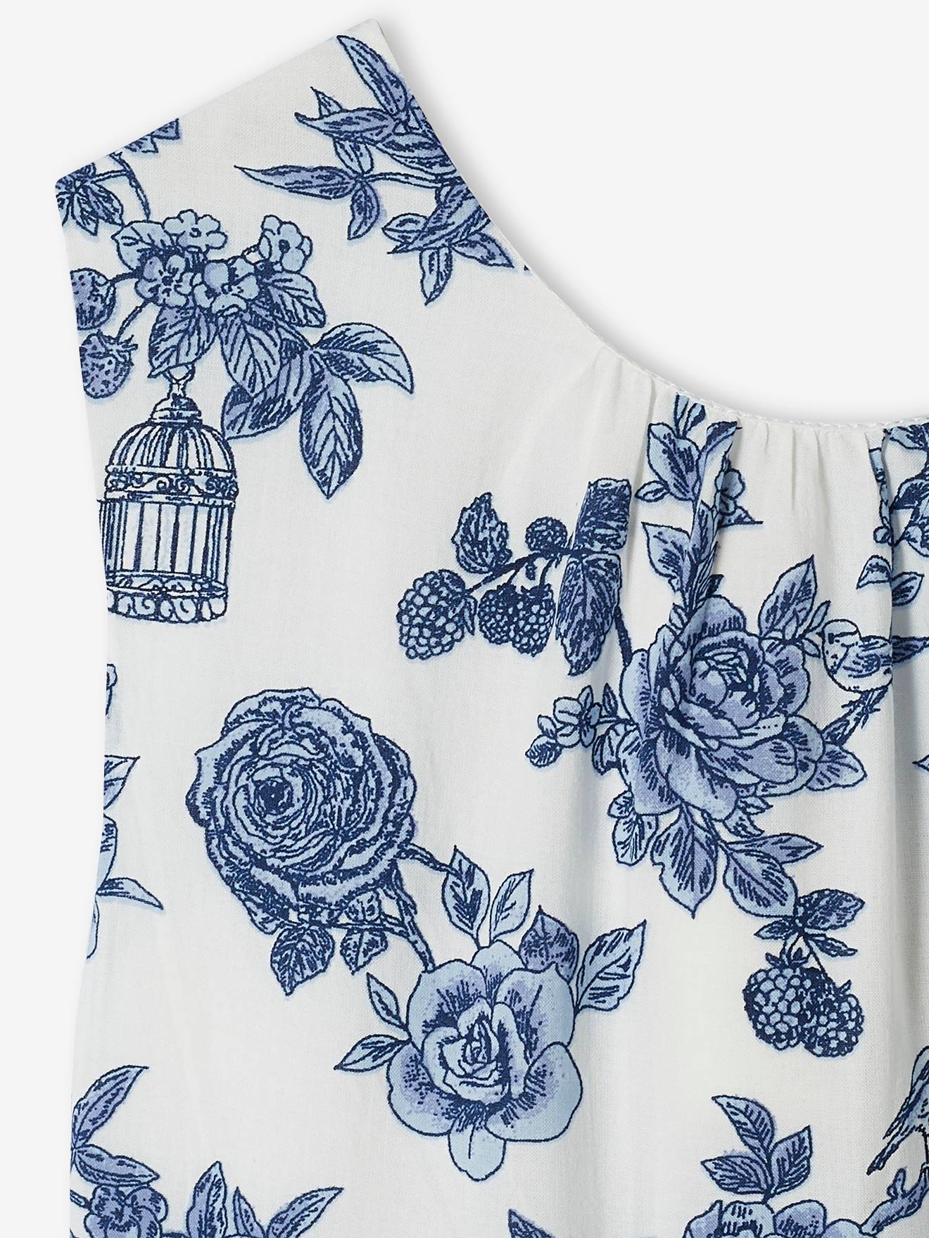Vestido de festa infantil com flores e laço nas costas, na cor branco-creme.