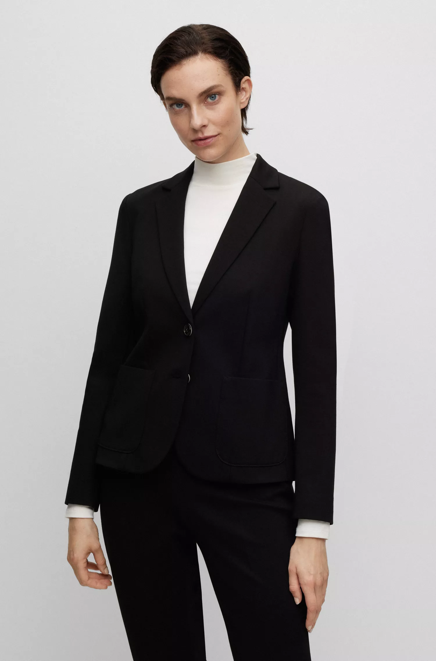 Jaqueta BOSS preta, extra slim fit, em tecido elástico.