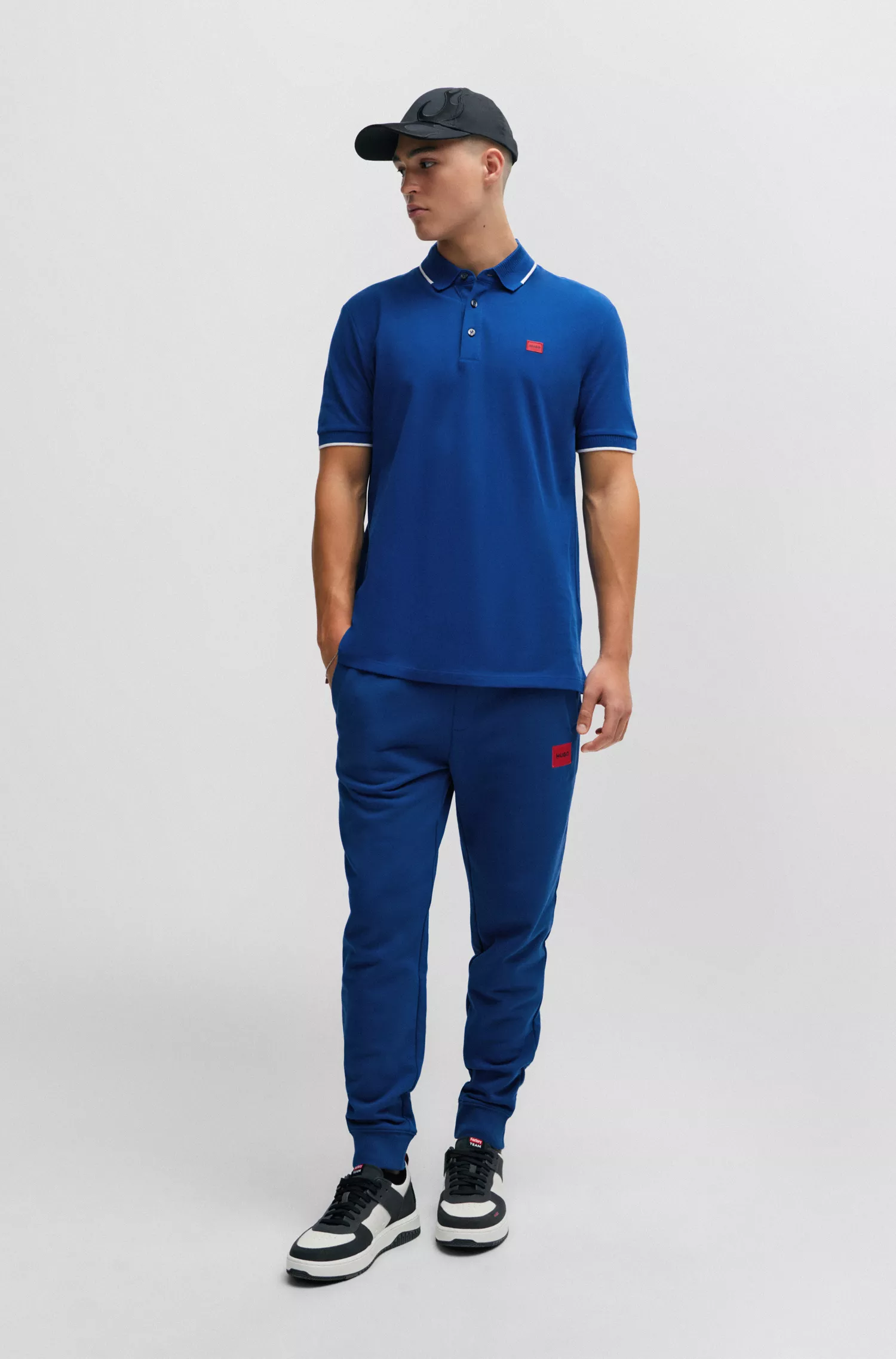 Camisa polo HUGO vermelha em piqué de algodão com corte slim e etiqueta vermelha com o logotipo.