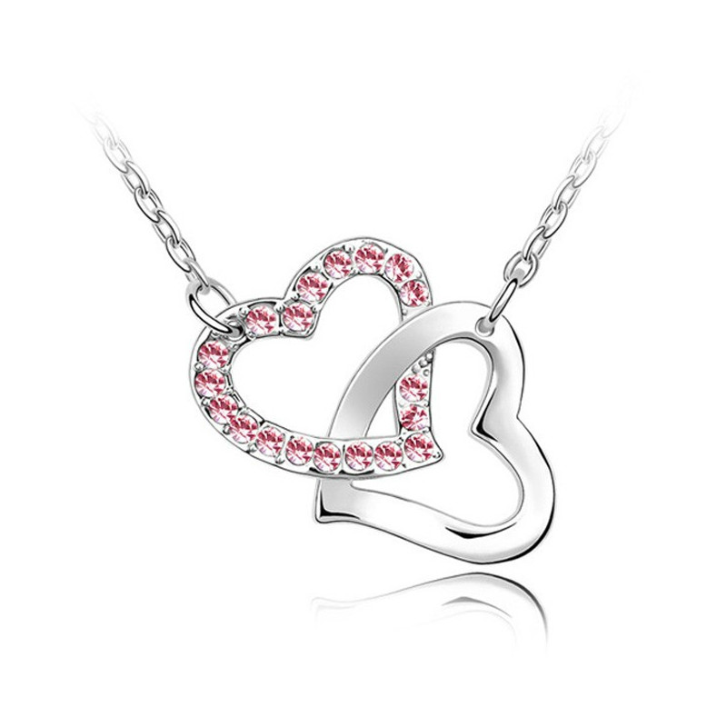 Collier double Coeurs entrelacés orné de Cristal rose de Swarovski et plaqué rhodium