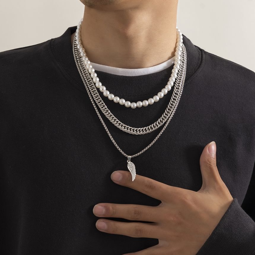 Gretlyn - Set: Kunstparelketting + Ketting + Vleugelhangerketting