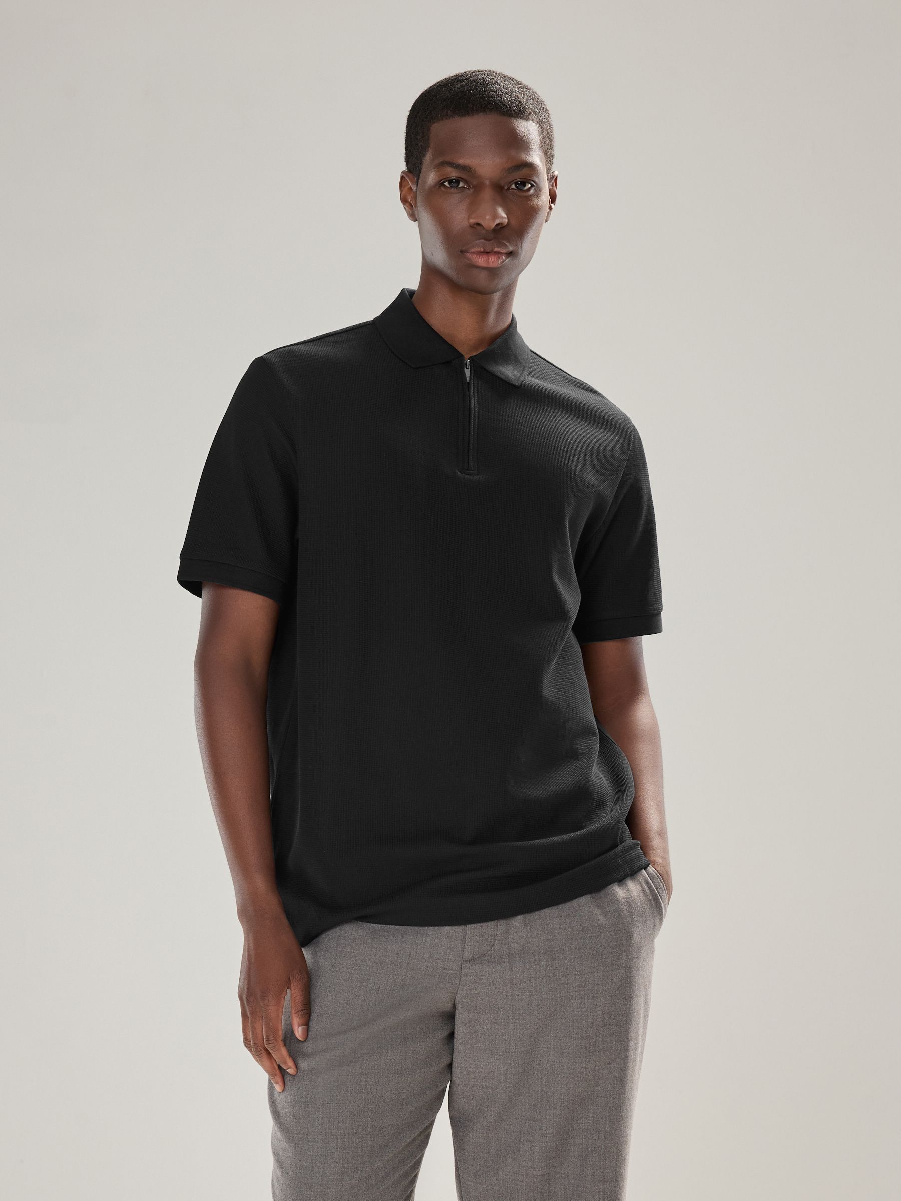 Zwart - Smart poloshirt met textuur en rits