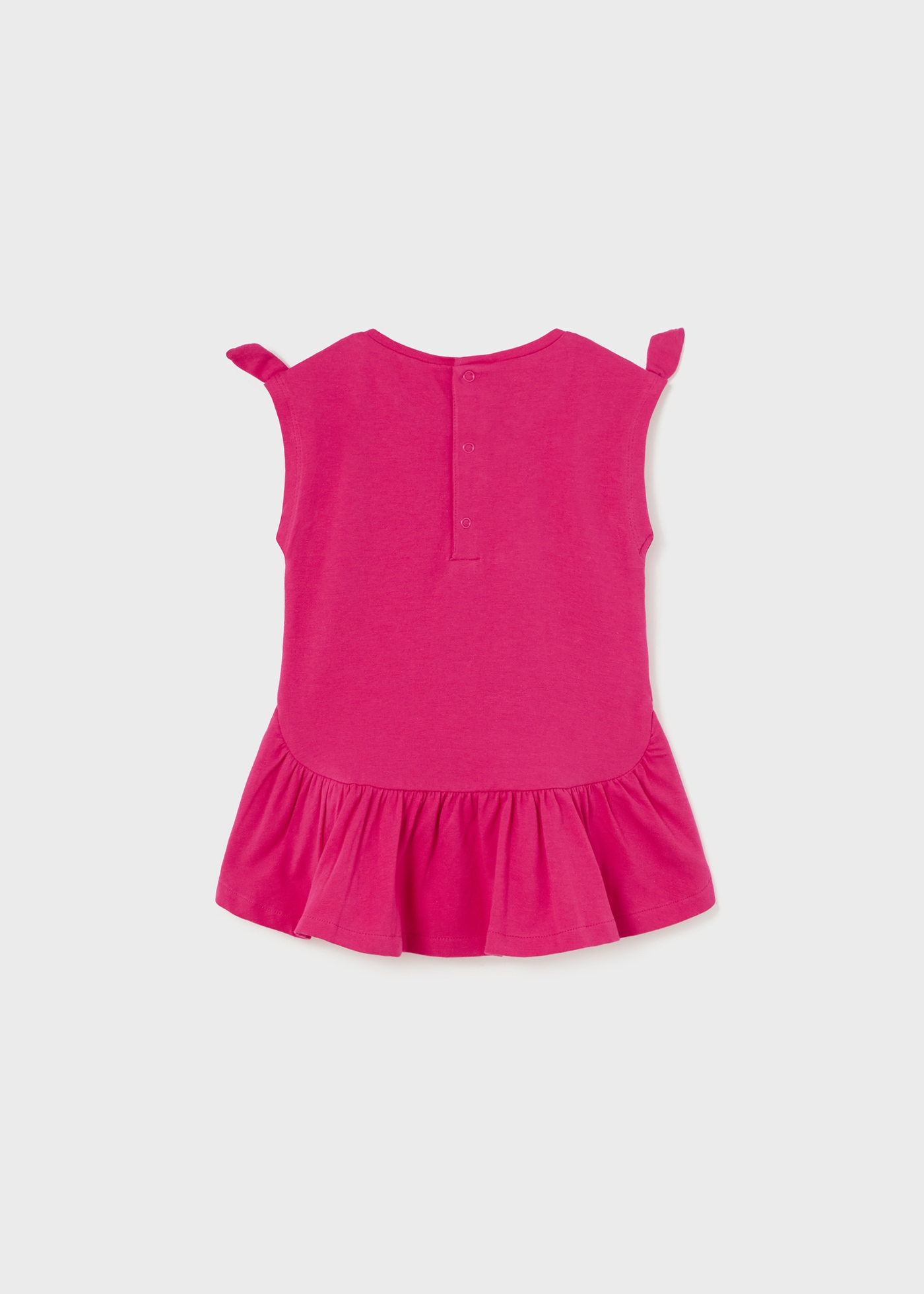 Vestido de bebê com estampa interativa feito de algodão sustentável.