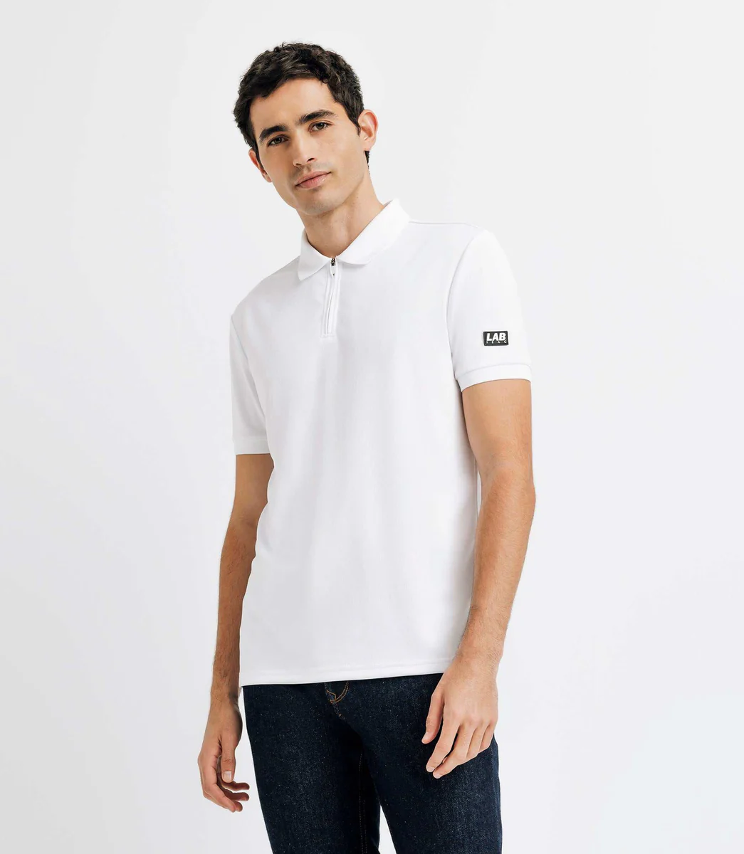 Polo col zippé avec patch blanc