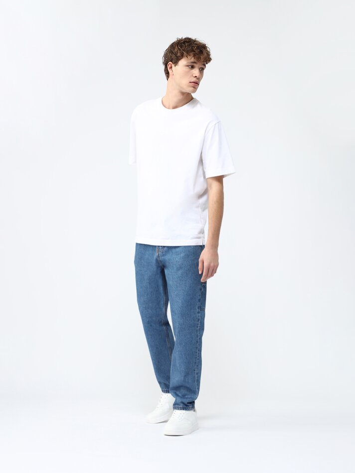 Calça jeans repaginada e com caimento relaxado - Índigo