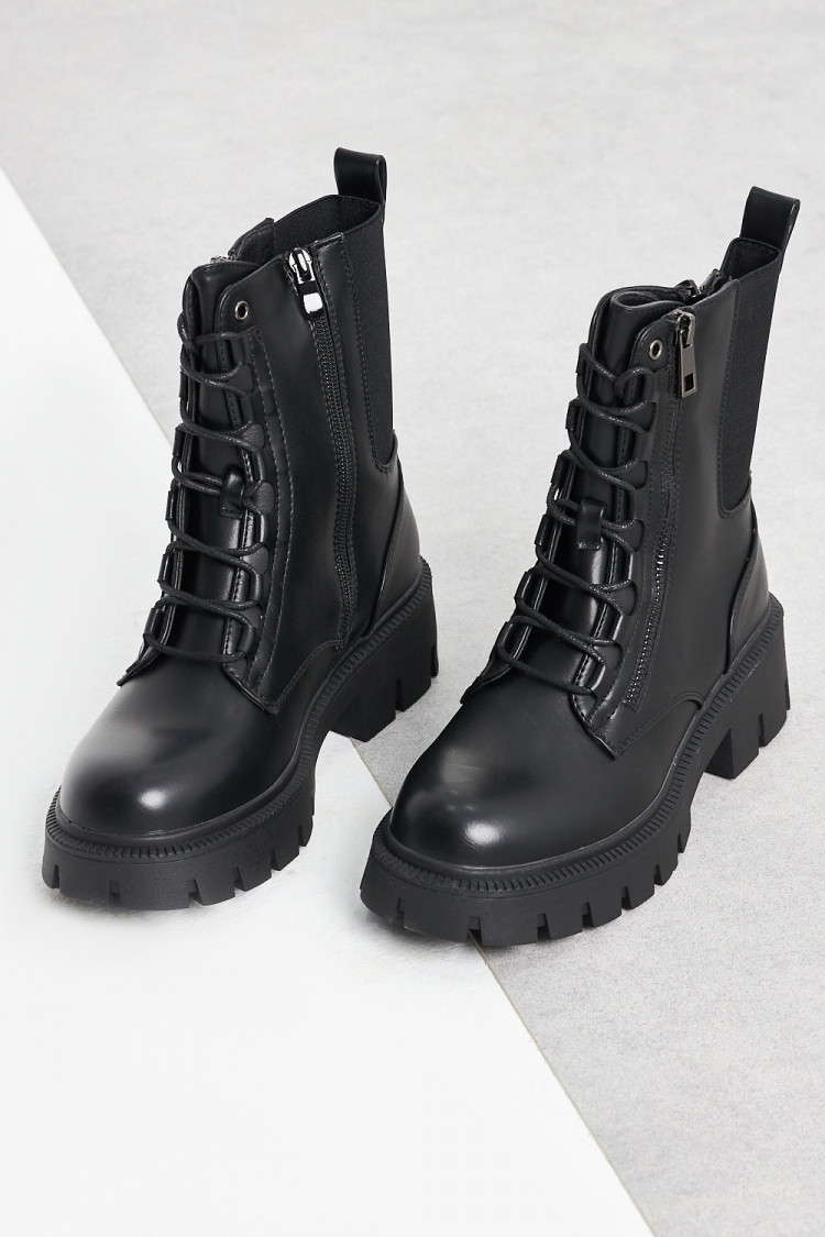 Bottines noires à empiècement bi-matière sur le côté et zip