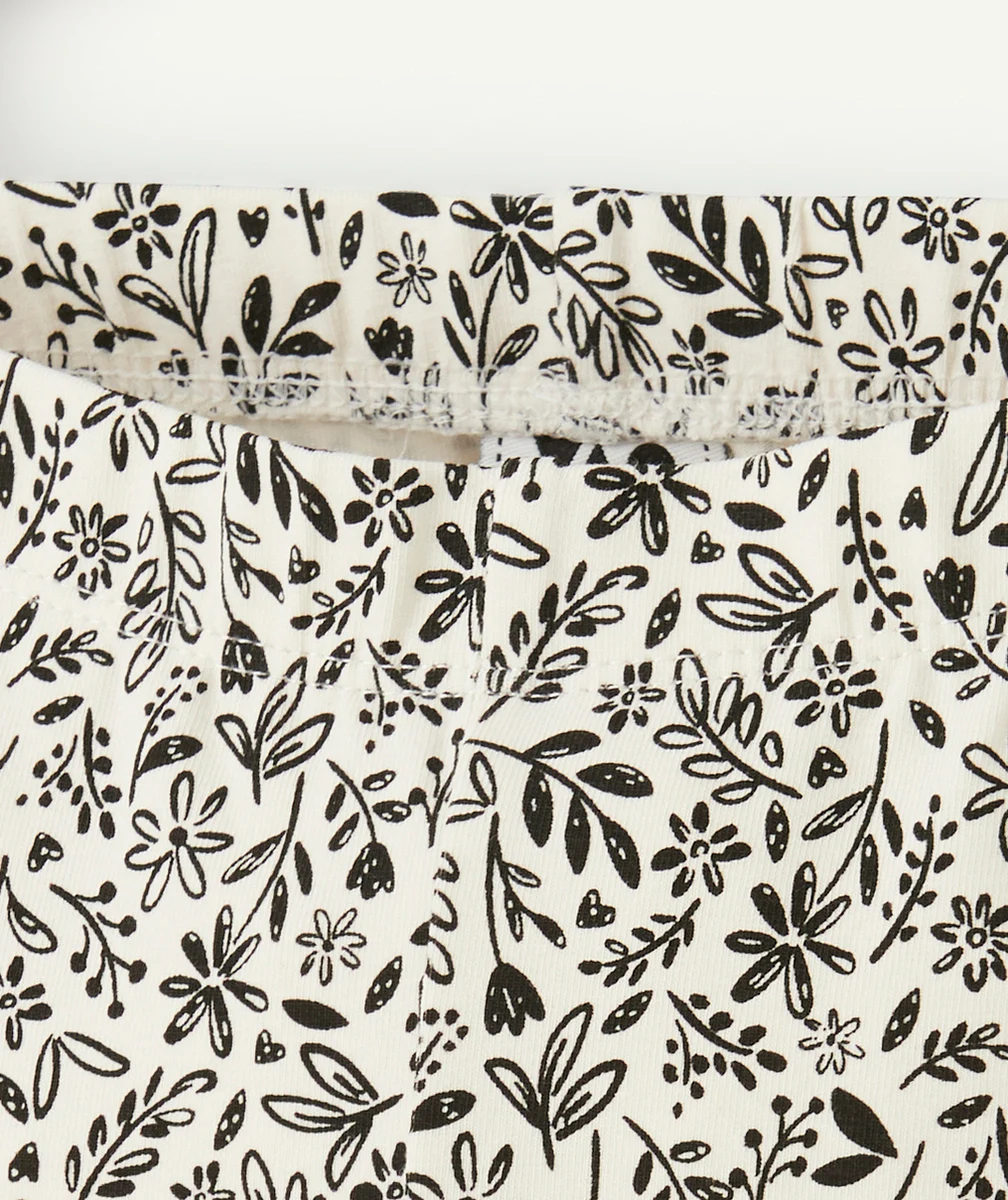 legging fille en coton bio blanc avec imprimé fleurs et feuilles noir