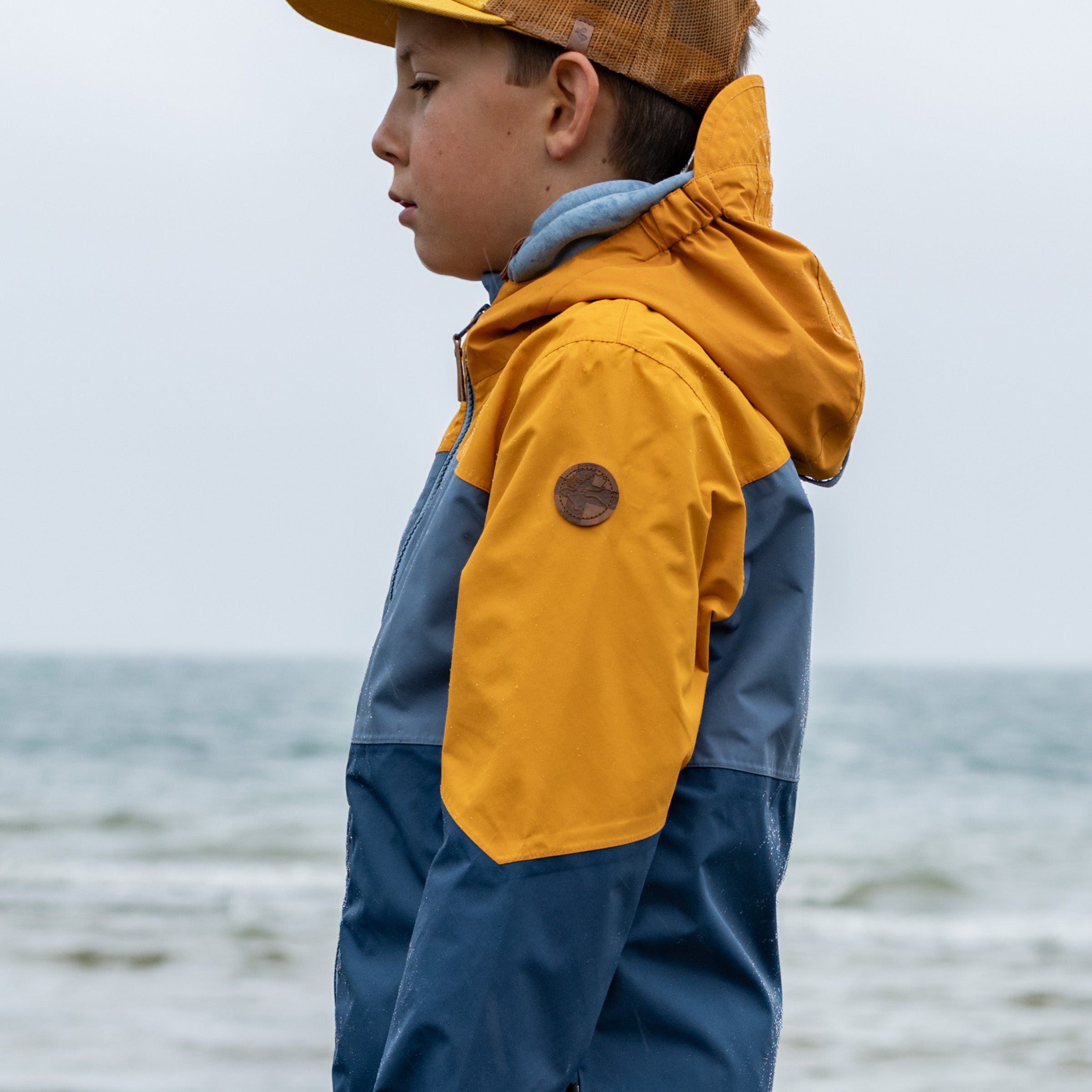 Kinder Regenjacke Wynn inca gold