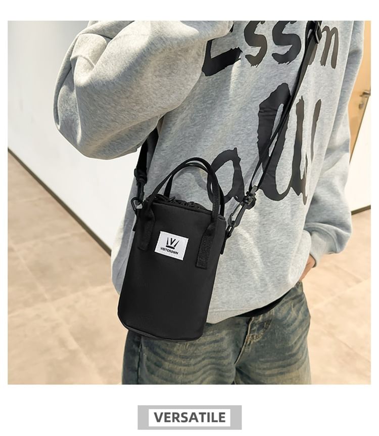 Hikuozy - Crossbodytas met trekkoord en letters