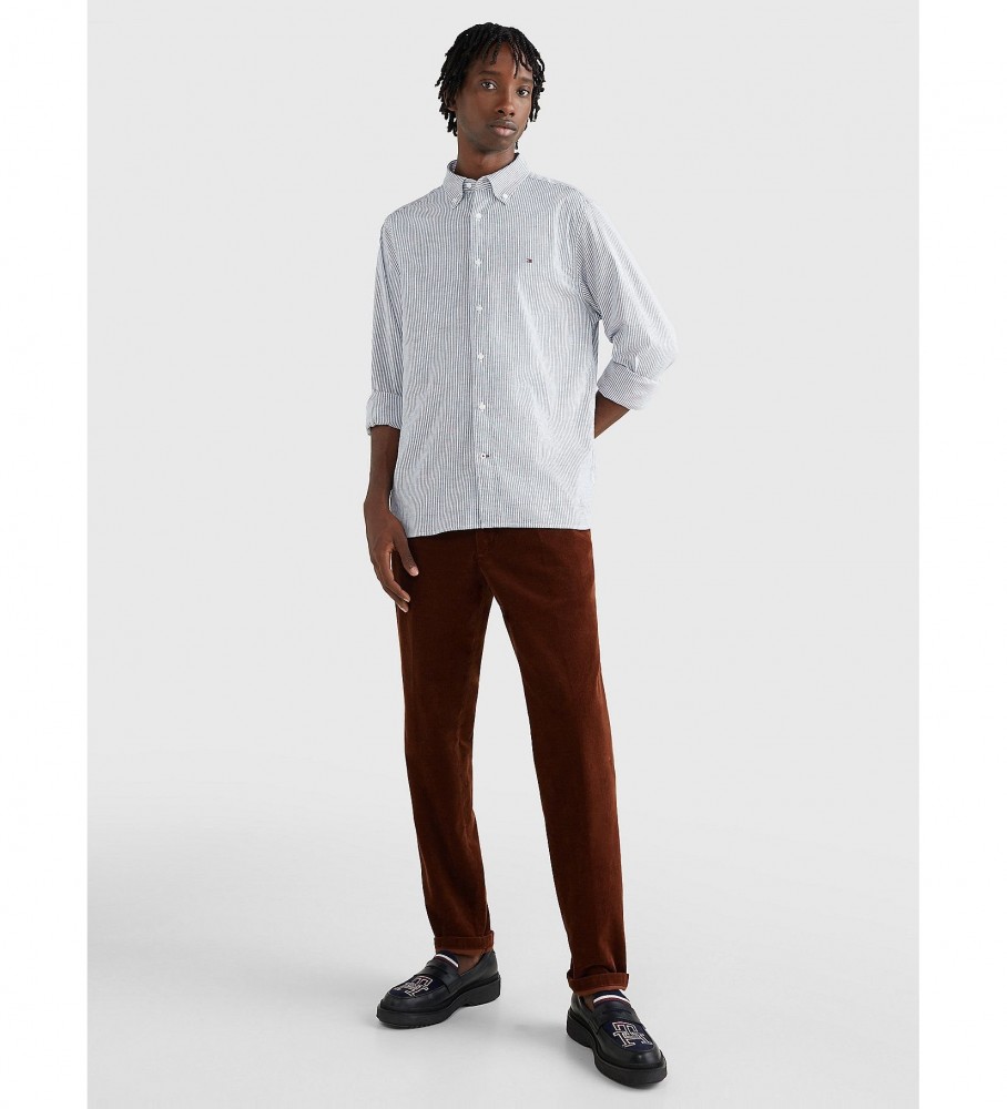 Camisa listrada Tommy Hilfiger TH Flex da coleção 1985, azul.
