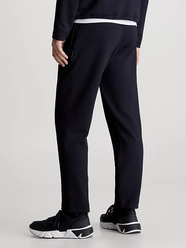 Calça jogger jacquard com cós duplo.