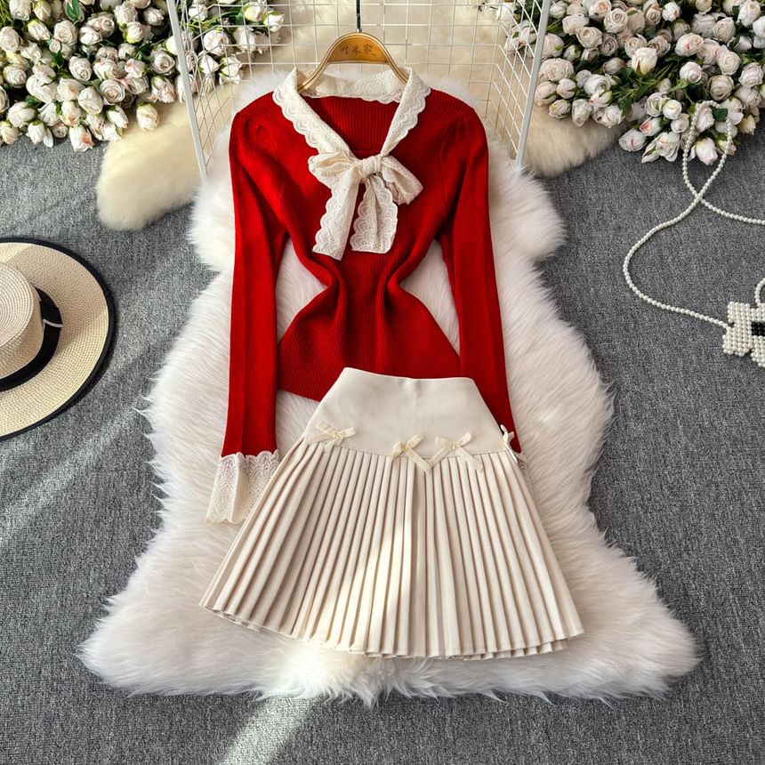 Yearnin - Set: lange mouwen, effen gebreide top met lintaccent + hoge taille mini-plooirok