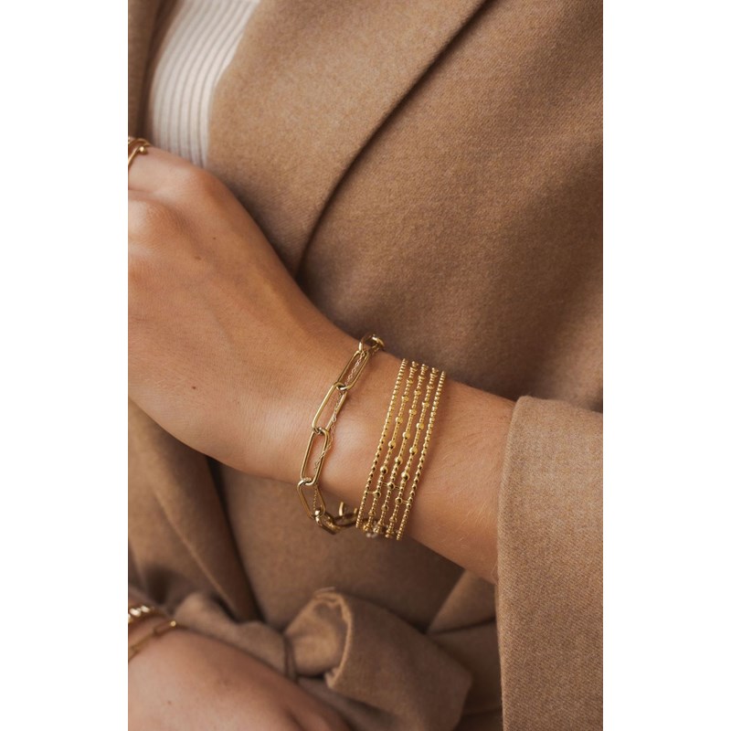 Bracelet rigide en acier doré ajustable
