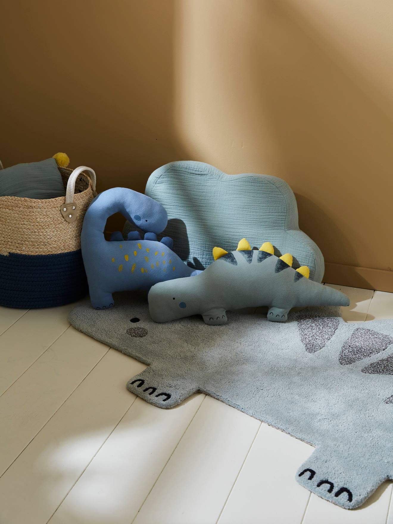 Conjunto de 2 almofadas pequenas com estampa de dinossauro, azul médio, lisas com detalhes.