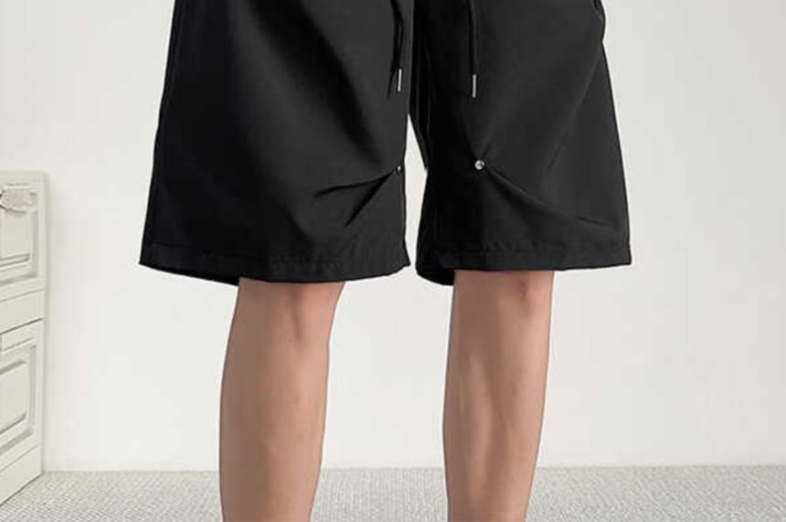 Fushet - Effen knielange shorts met trekkoord in de taille