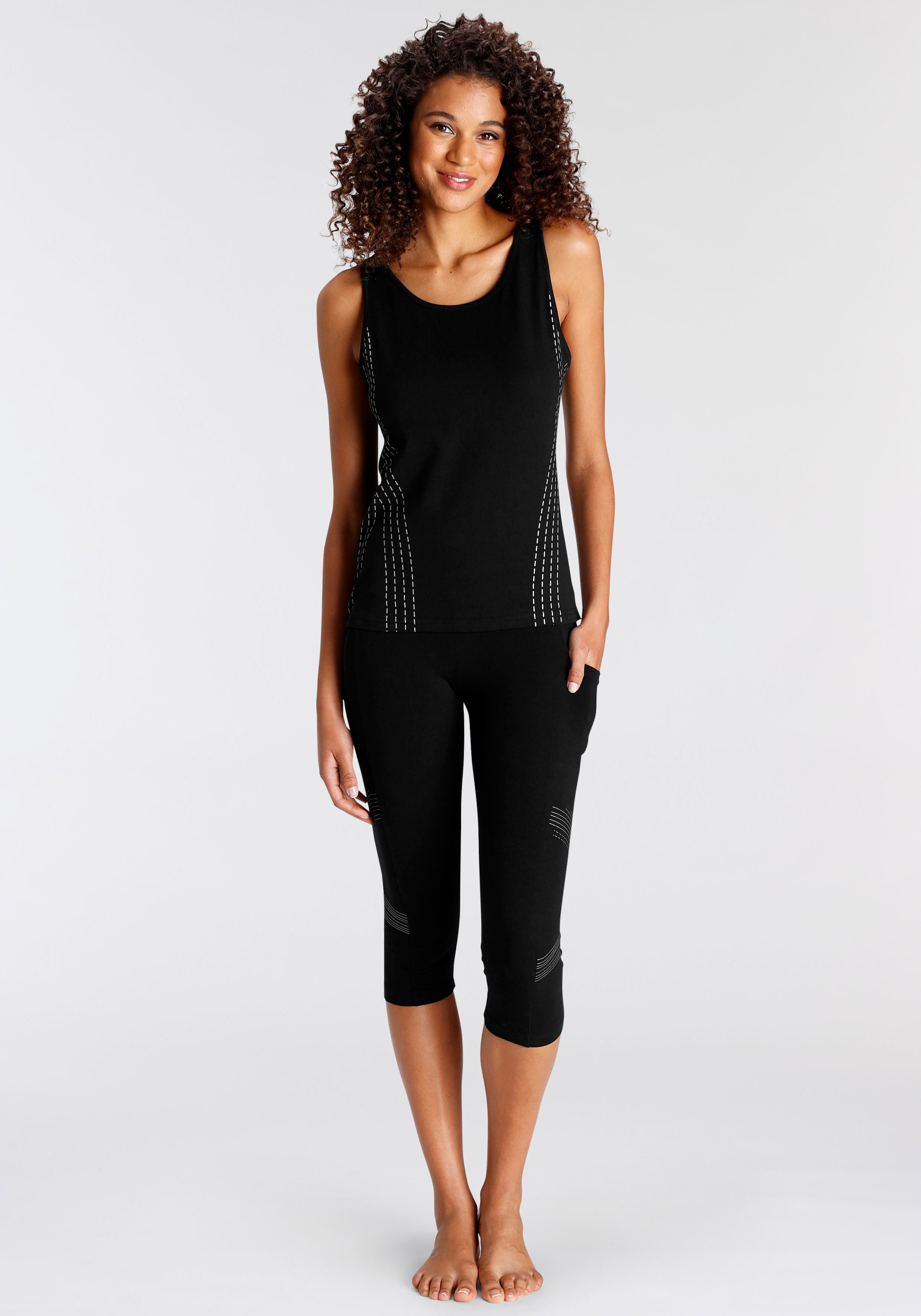 LASCANA ACTIVE Caprileggings  mit optischen Reflektortprint und Handytasche
