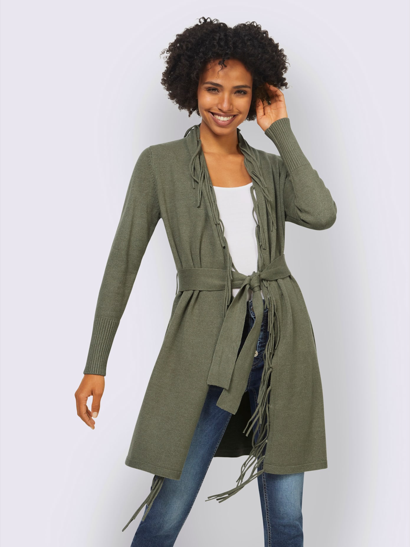 Veste en tricot bords à fines franges