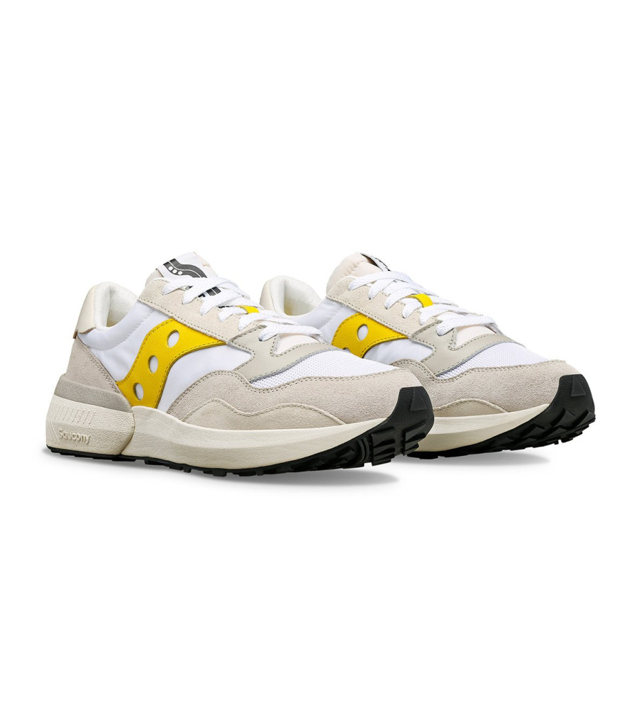 Tênis Saucony Jazz Nxt de couro, branco e amarelo.