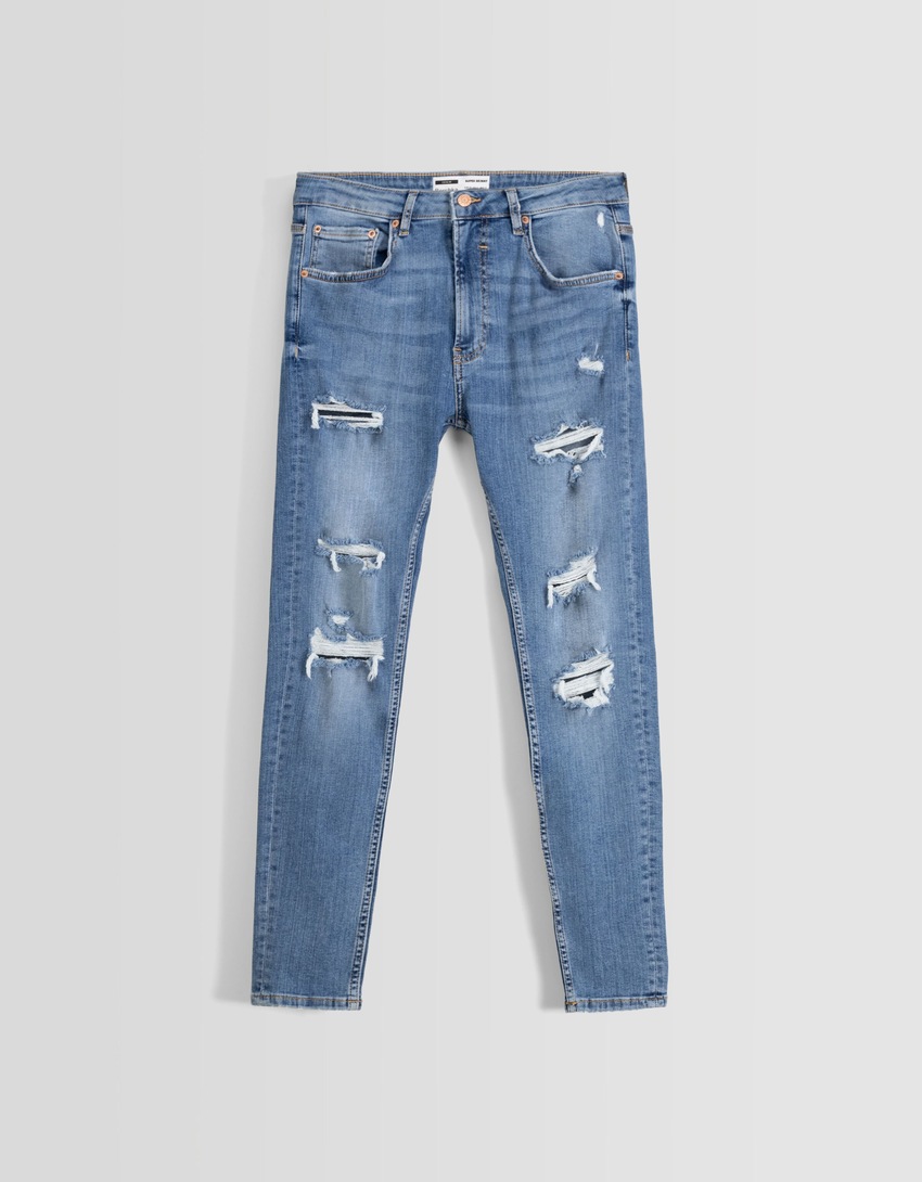 calça jeans super skinny rasgada