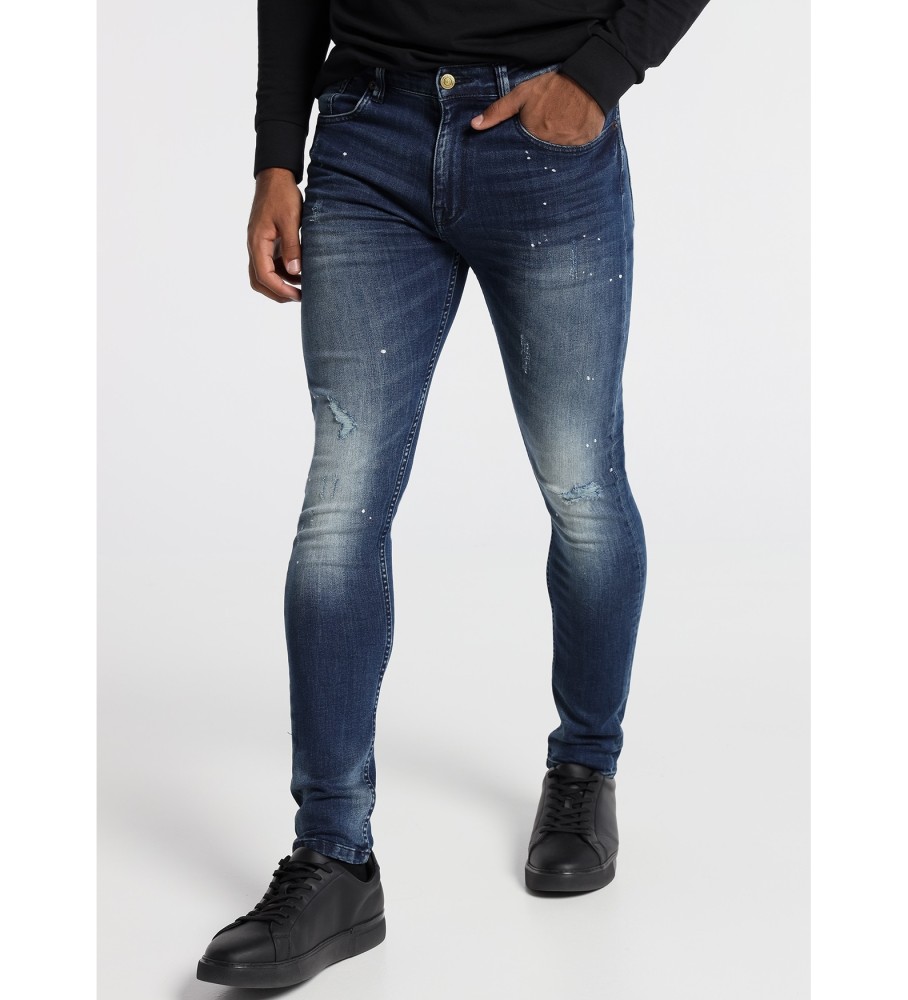 Calça jeans Six Valves, jeans azul escuro, skinny rasgada, cinza.