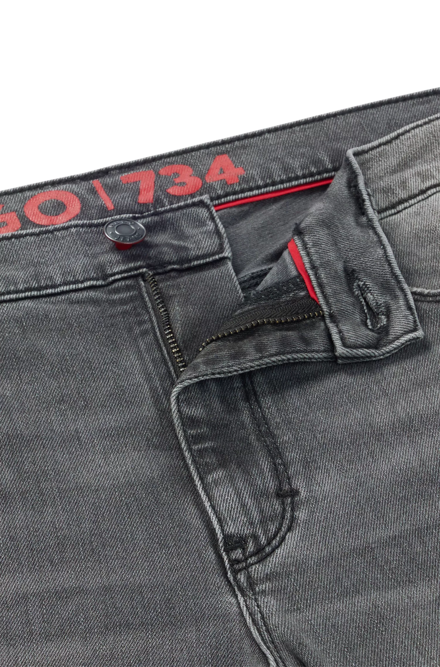 Calça jeans HUGO vermelha, extra slim fit, em denim stretch com lavagem prateada.