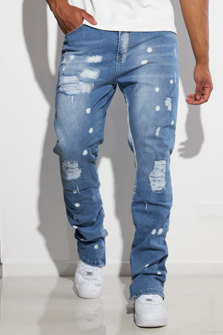 Jeans bleu zippé, taché et déchiré