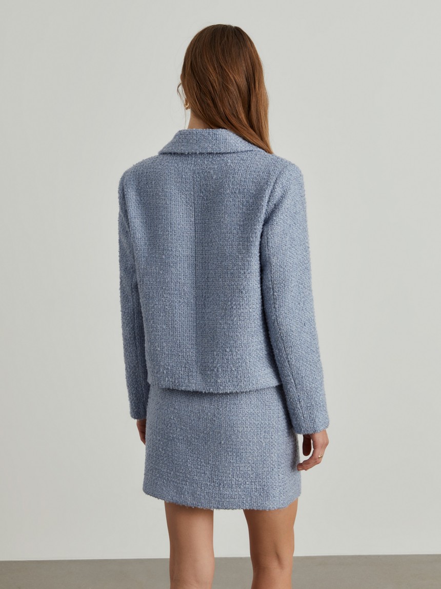 Casaco tweed cruzado com bolsos