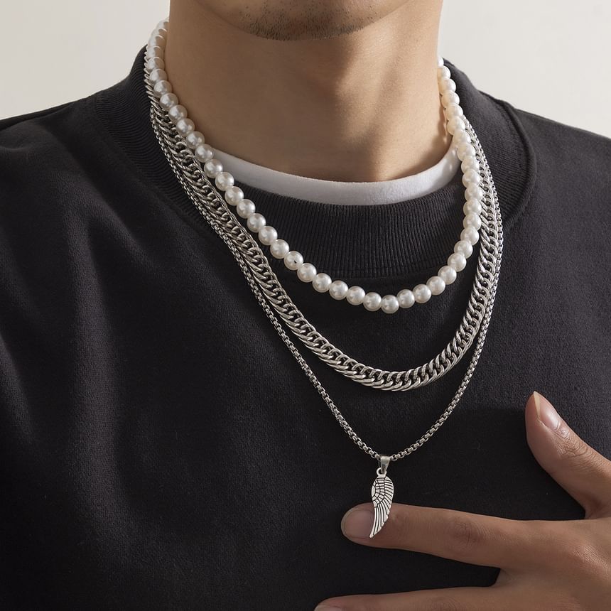 Gretlyn - Set: Kunstparelketting + Ketting + Vleugelhangerketting