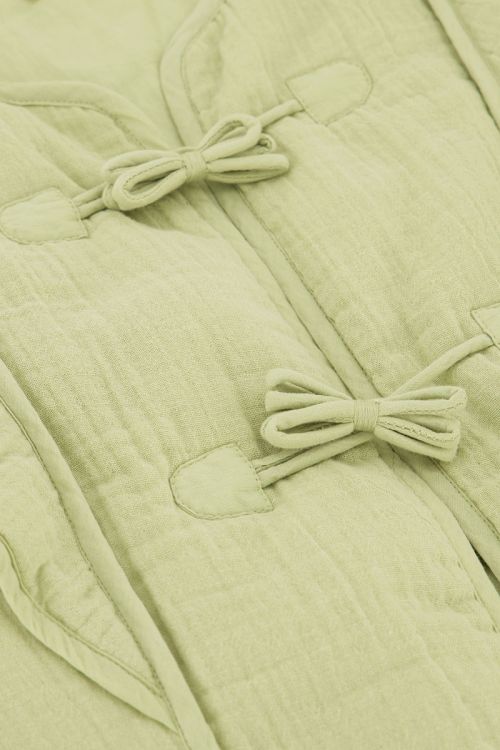 Groen gilet met strikjes en ruffles