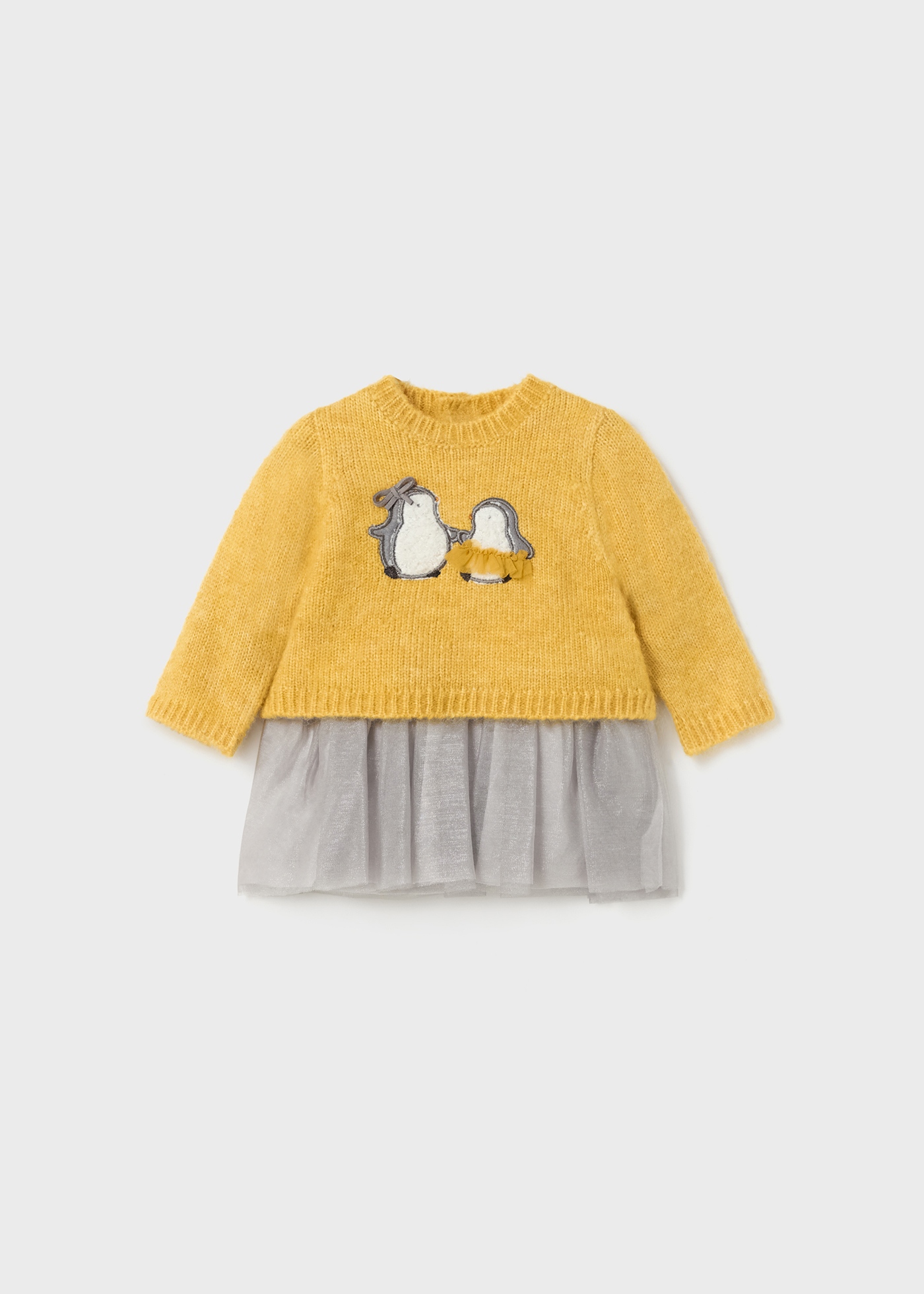 Vestido para recém-nascidos em malha e tule combinados.