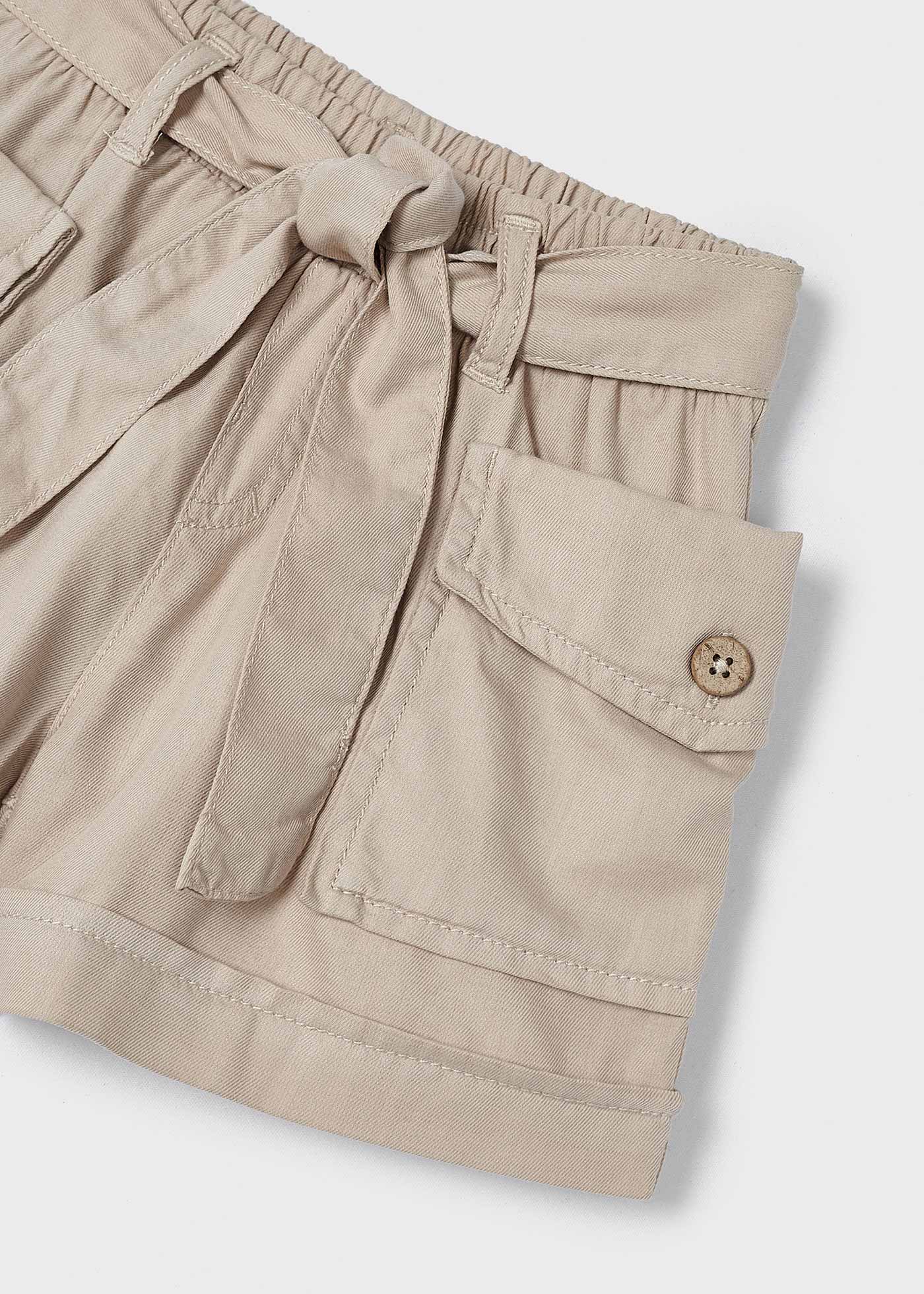 Calções para menina com bolsos, em ganga escura.