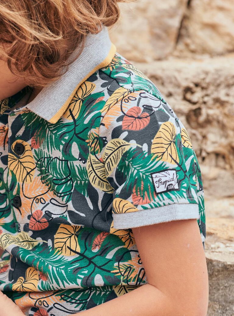 Polo gris à imprimé feuilles tropicales