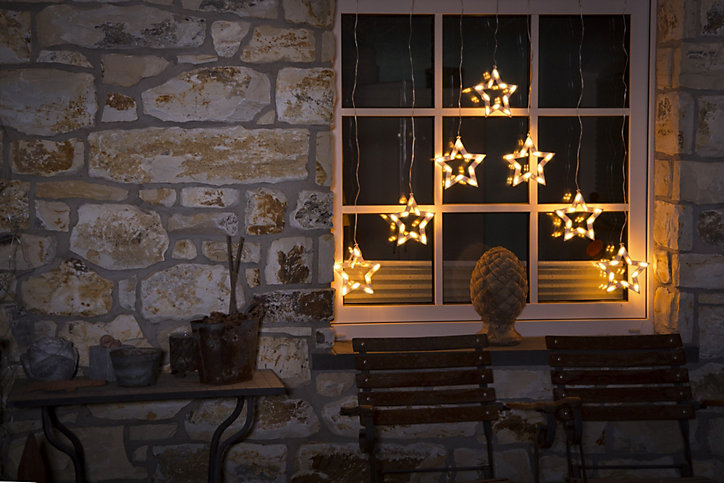 Rideau lumineux à 70 LED blanc chaud 7 silhouettes d'étoiles cable transparent