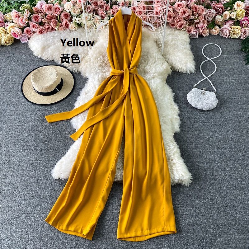 Yearnin - Mouwloze jumpsuit met strikceintuur en wijde pijpen