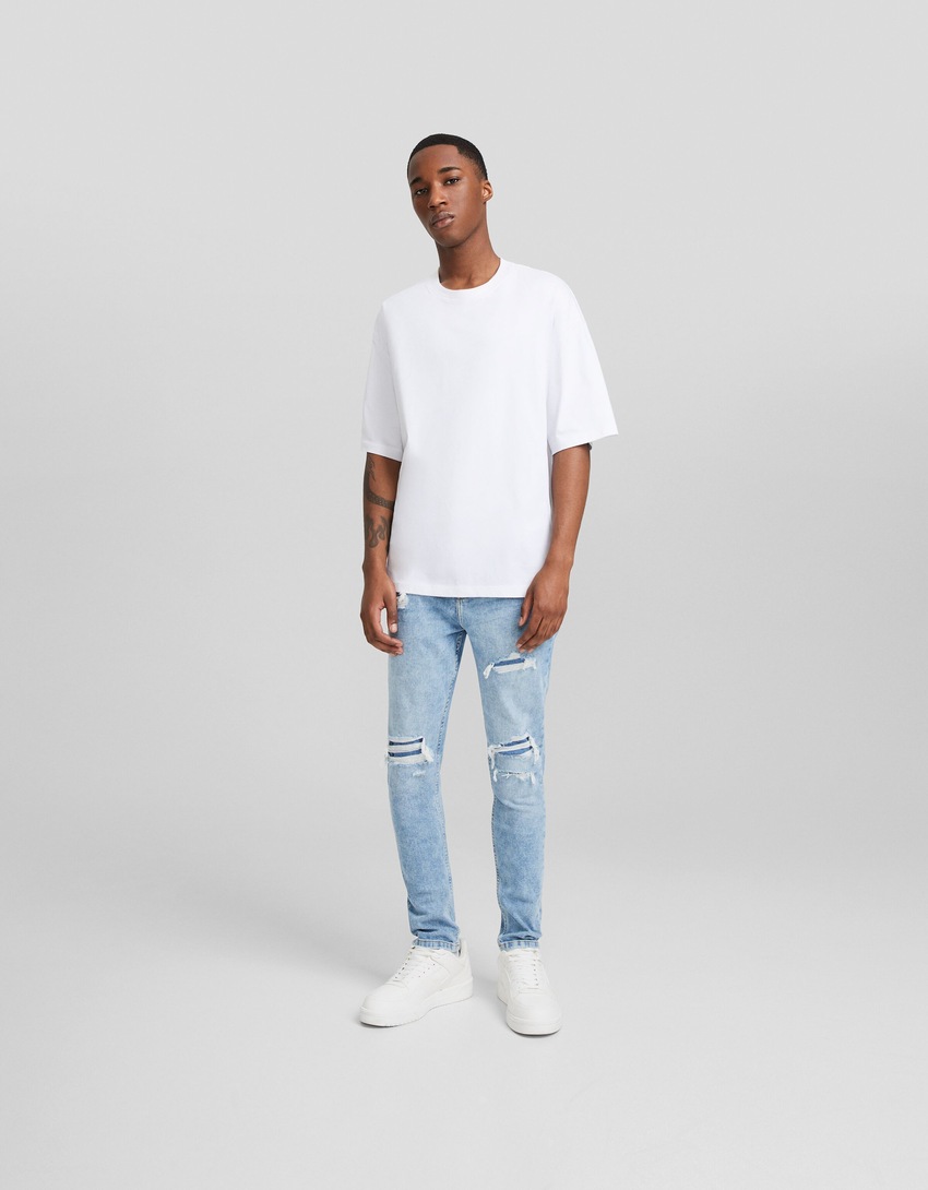 calça jeans cenoura rasgada