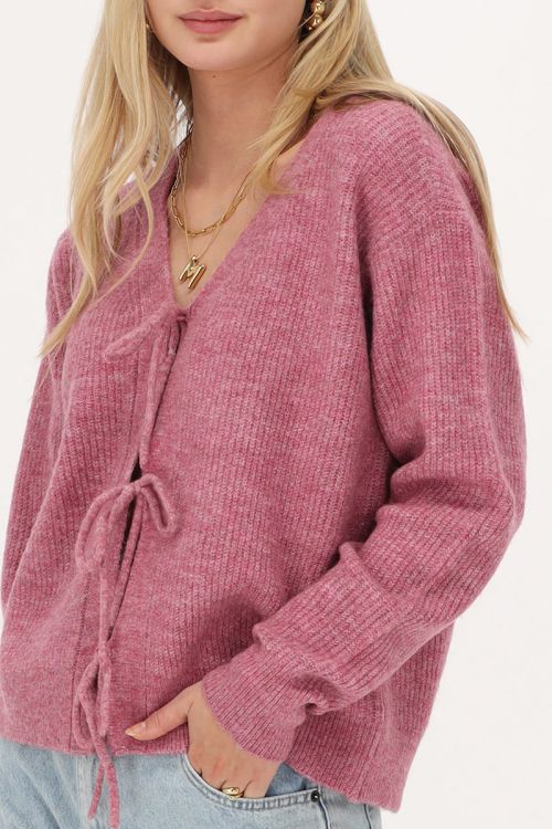 Roze vest met strikjes