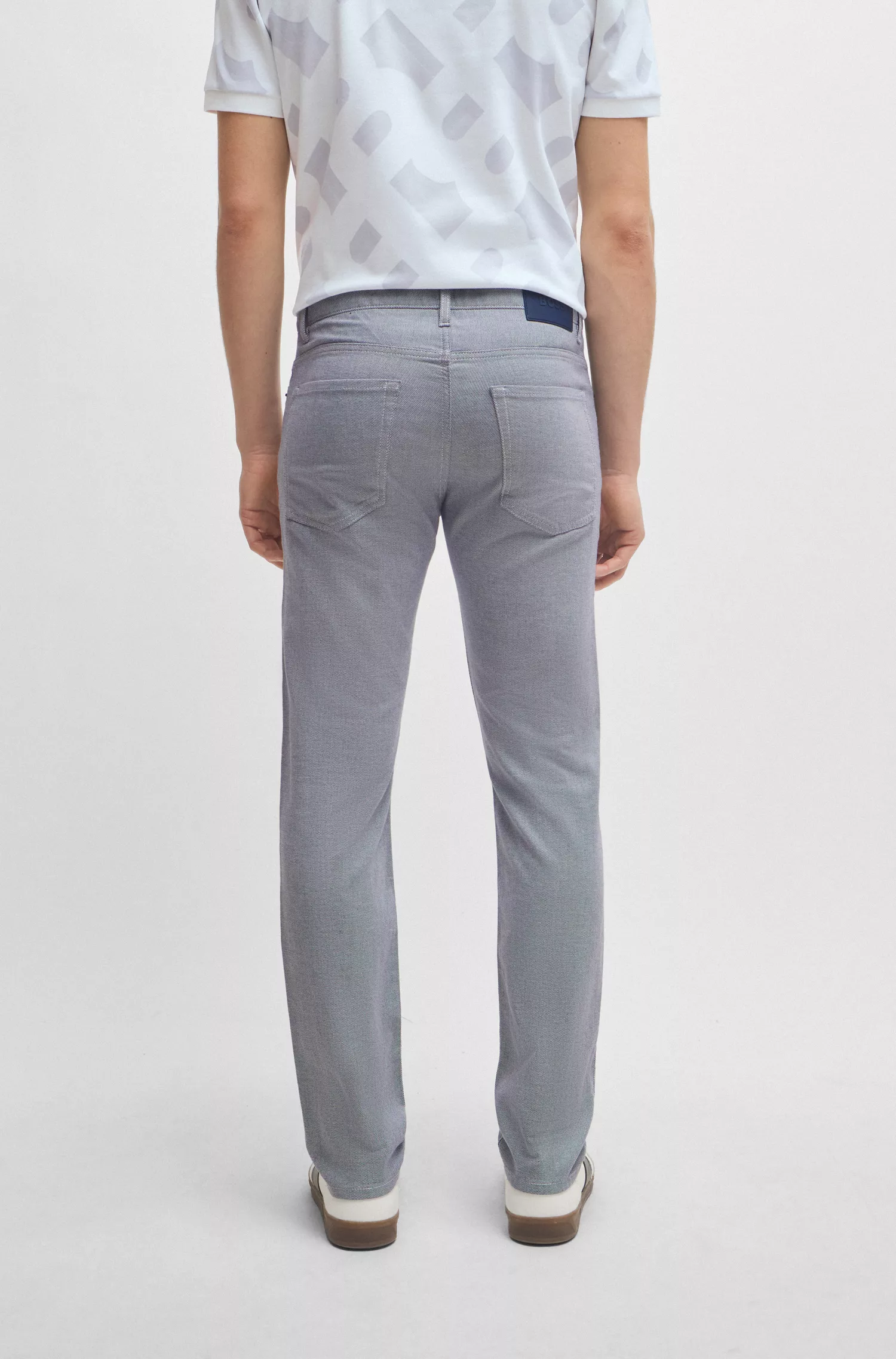 Calça jeans BOSS preta, corte slim, em denim stretch bicolor.