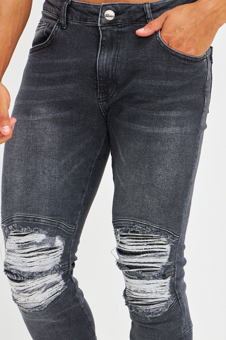 Jean effet déchiré aux genoux noir délavé