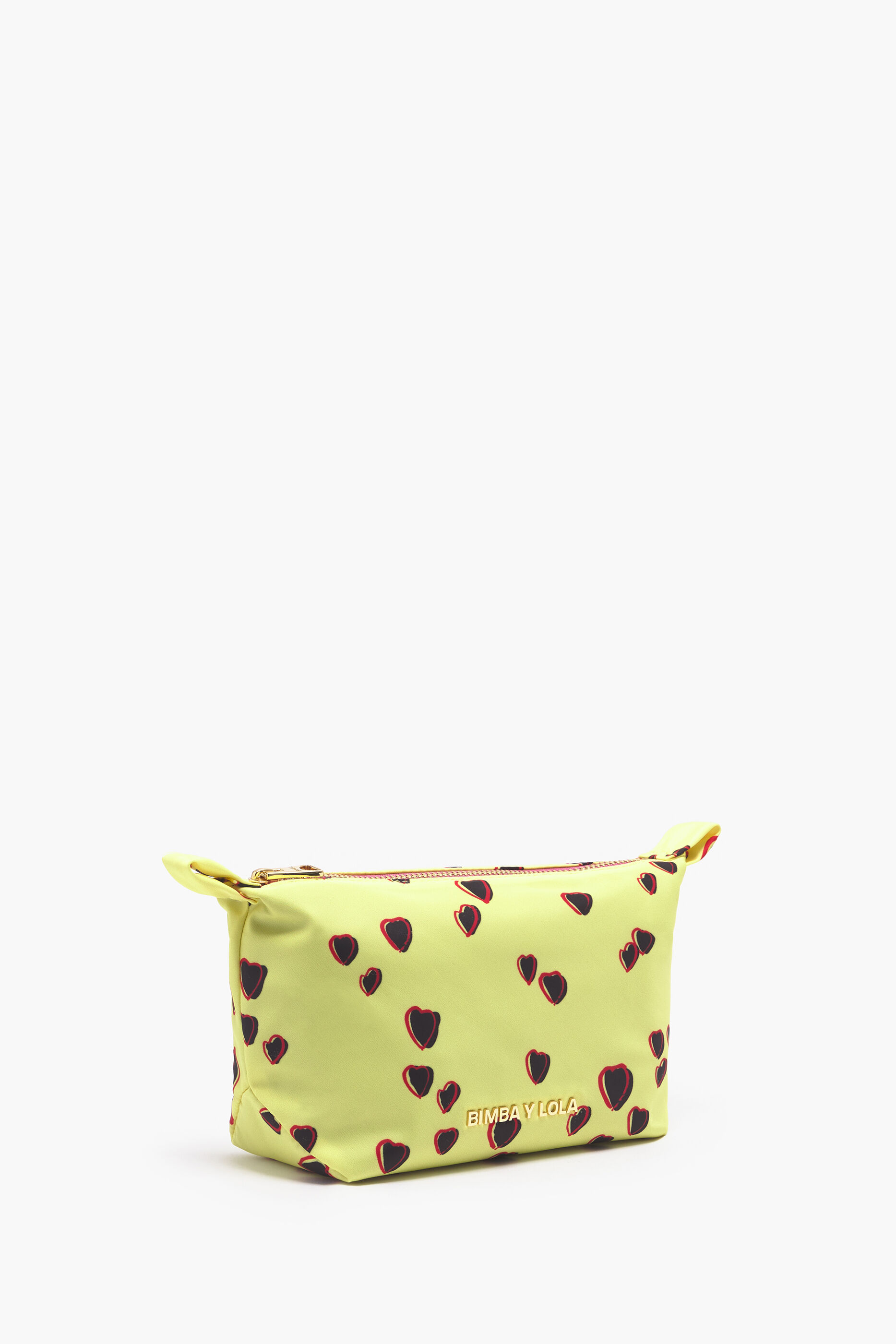 Nécessaire trapezoidal com estampa de corações pequenos em amarelo.