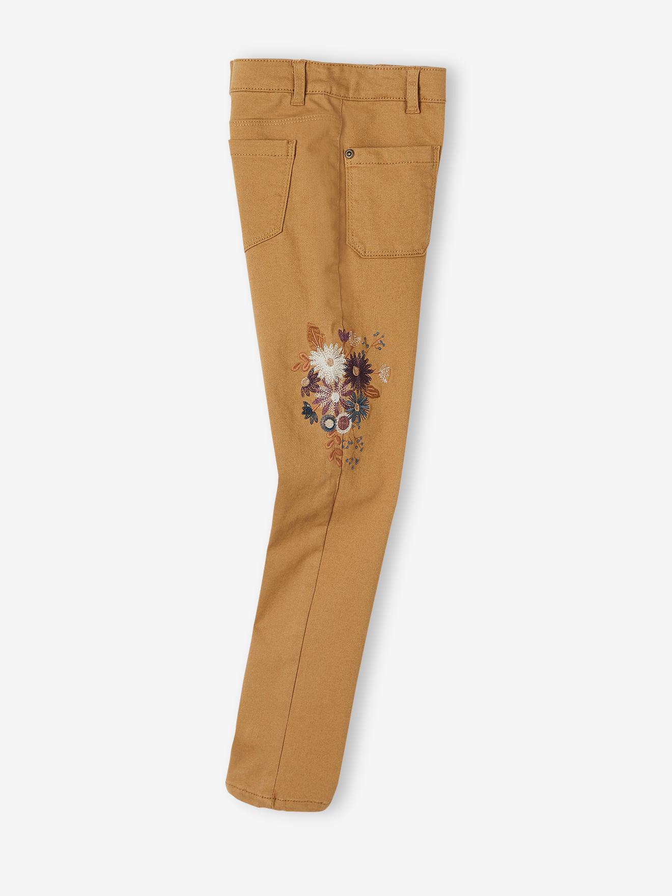 Calças justas com bordado floral e cintura alta, lisas em tom castanho claro com motivos florais para meninas.